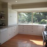 Large kitchen appliance cabinet with roller door and lots of drawers